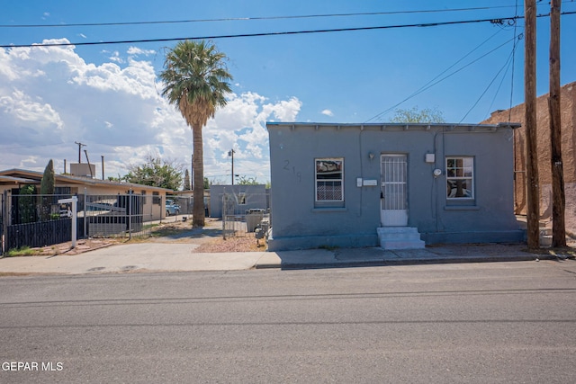 219 Dolan St, El Paso, TX 79905 - view of front of property with entry steps, stucco siding, and fence private yard