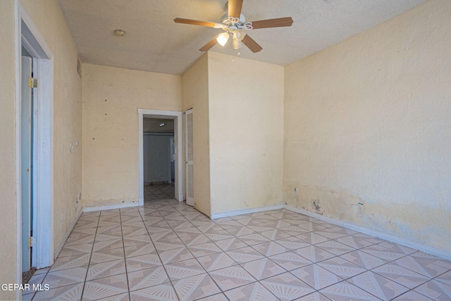 219 Dolan St, El Paso, TX 79905 - unfurnished room featuring baseboards, ceiling fan, and a textured ceiling