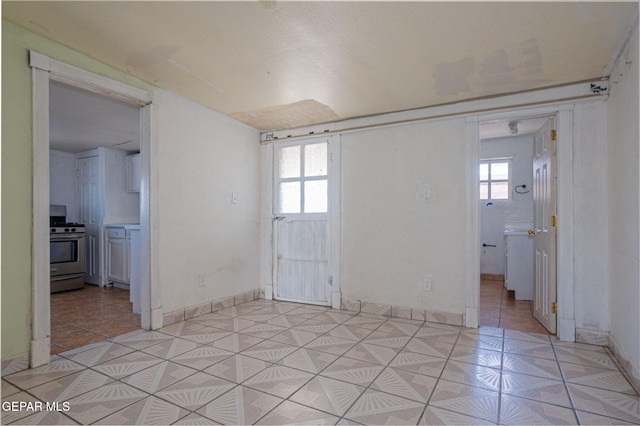 219 Dolan St, El Paso, TX 79905 - empty room with light tile patterned floors