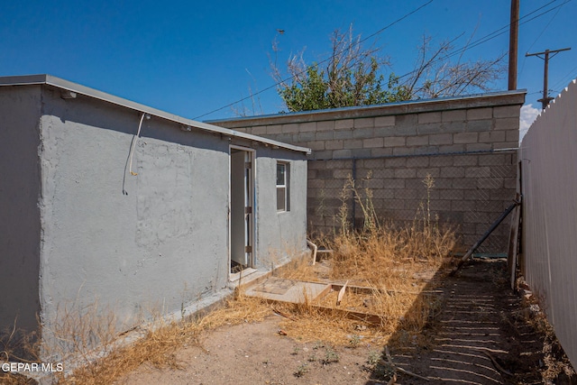 219 Dolan St, El Paso, TX 79905 - view of property exterior featuring fence and stucco siding