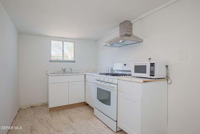 219 Dolan St, El Paso, TX 79905 - kitchen with marble finish floor, white appliances, a sink, wall chimney range hood, and white cabinets