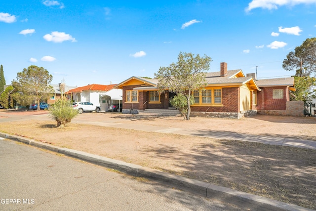 3020 Wheeling Ave, El Paso, TX 79930 - view of front facade with brick siding and a chimney