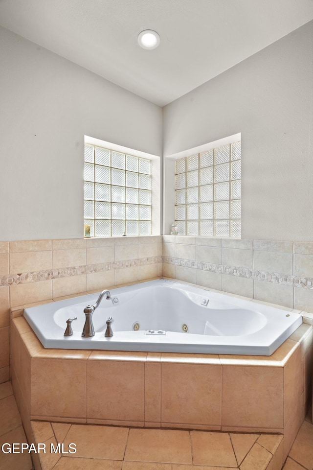 3020 Wheeling Ave, El Paso, TX 79930 - bathroom featuring a tub with jets and tile patterned floors