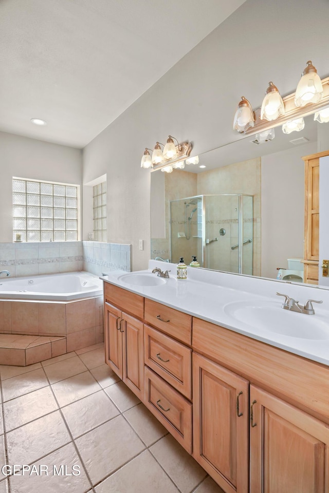 3020 Wheeling Ave, El Paso, TX 79930 - full bathroom with tile patterned floors, a stall shower, double vanity, and a garden tub