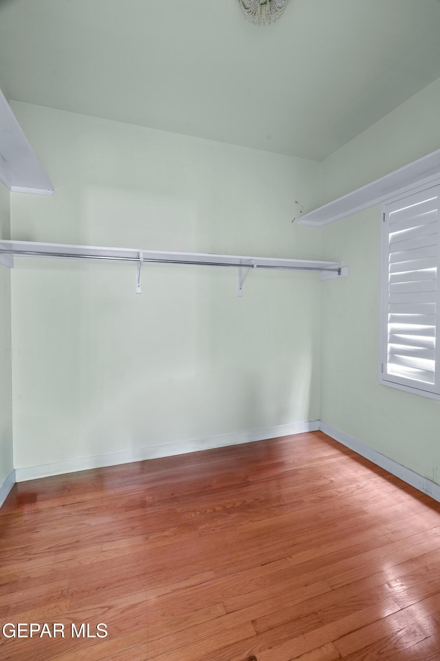 3020 Wheeling Ave, El Paso, TX 79930 - spacious closet featuring wood finished floors