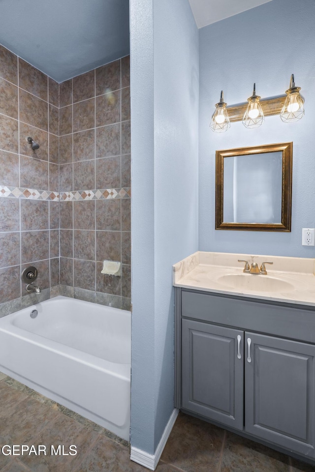 3020 Wheeling Ave, El Paso, TX 79930 - full bath featuring tile patterned floors, vanity, and shower / tub combination