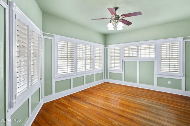 3020 Wheeling Ave, El Paso, TX 79930 - empty room with ceiling fan, wood finished floors, and healthy amount of natural light