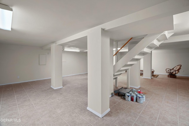 3020 Wheeling Ave, El Paso, TX 79930 - finished below grade area with stairs, baseboards, and light tile patterned flooring