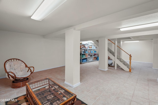 3020 Wheeling Ave, El Paso, TX 79930 - finished below grade area featuring light tile patterned flooring, stairs, and baseboards