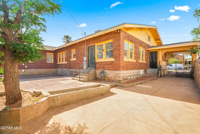 3020 Wheeling Ave, El Paso, TX 79930 - back of house with entry steps, brick siding, and a gate