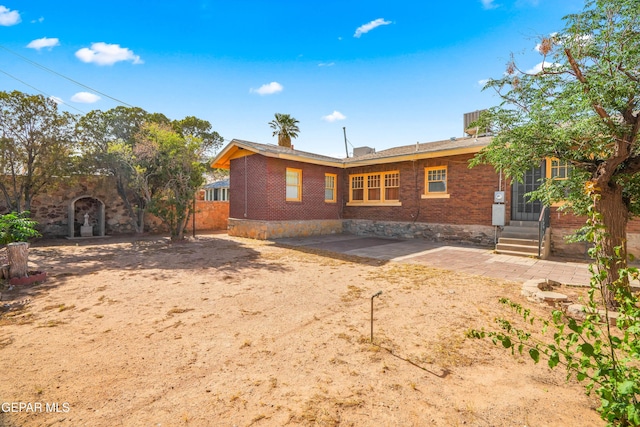 3020 Wheeling Ave, El Paso, TX 79930 - rear view of house with entry steps and brick siding