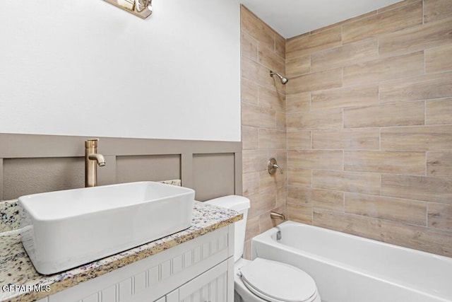 full bathroom with toilet,  shower combination, and vanity