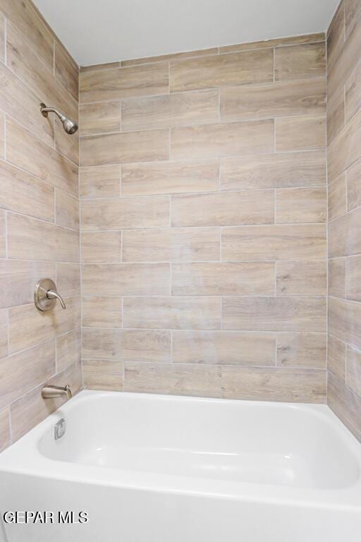 full bath featuring washtub / shower combination