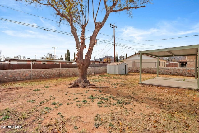 fenced backyard with a patio area