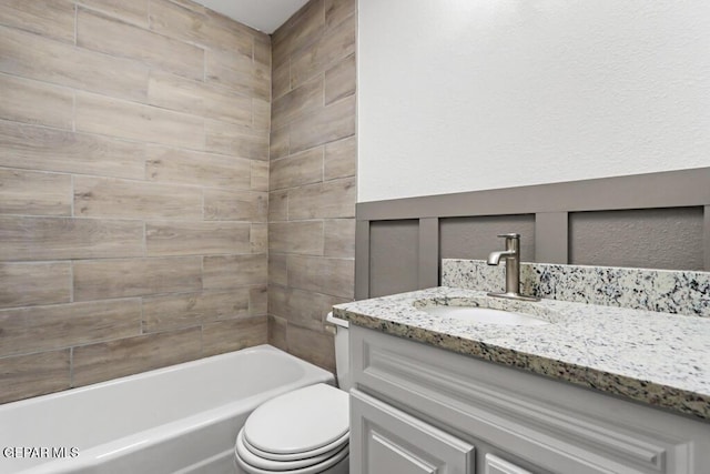 bathroom with vanity, toilet, and bathtub / shower combination