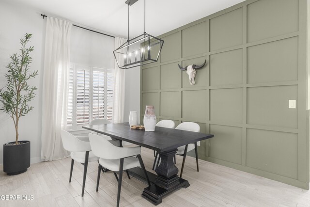 13352 Eton Ct, El Paso, TX 79928 - dining space featuring a decorative wall, a chandelier, and light wood-style floors