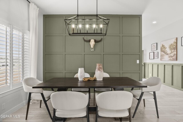 13352 Eton Ct, El Paso, TX 79928 - dining area featuring a decorative wall, plenty of natural light, a chandelier, and baseboards