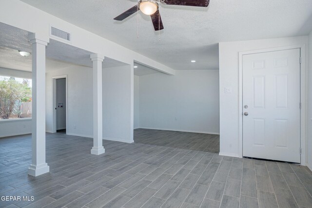 420 Kelvin Ave, El Paso, TX 79915 - below grade area featuring a ceiling fan, baseboards, wood finished floors, and a textured ceiling