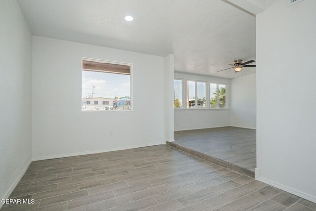 420 Kelvin Ave, El Paso, TX 79915 - spare room featuring a ceiling fan, wood finished floors, baseboards, and recessed lighting