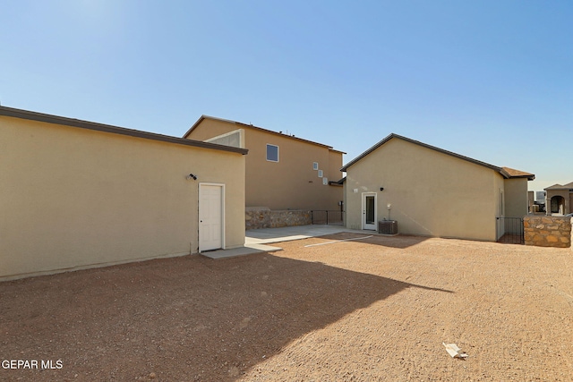 14296 Chris Zingo Ln, El Paso, TX 79928 - back of house with stucco siding, a patio area, and central AC
