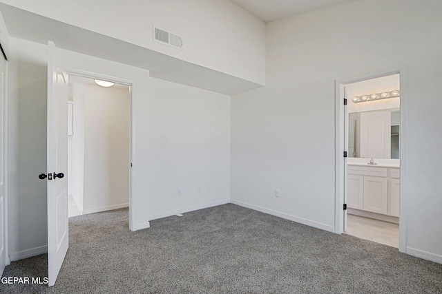 14296 Chris Zingo Ln, El Paso, TX 79928 - unfurnished bedroom featuring ensuite bath, visible vents, baseboards, and carpet floors