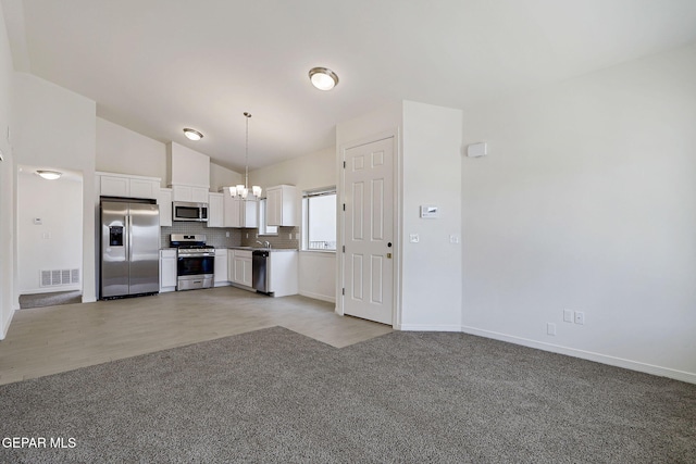 14296 Chris Zingo Ln, El Paso, TX 79928 - kitchen featuring white cabinets, visible vents, light colored carpet, appliances with stainless steel finishes, and a chandelier