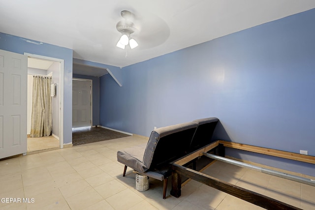 bedroom featuring tile patterned floors, ceiling fan, and baseboards