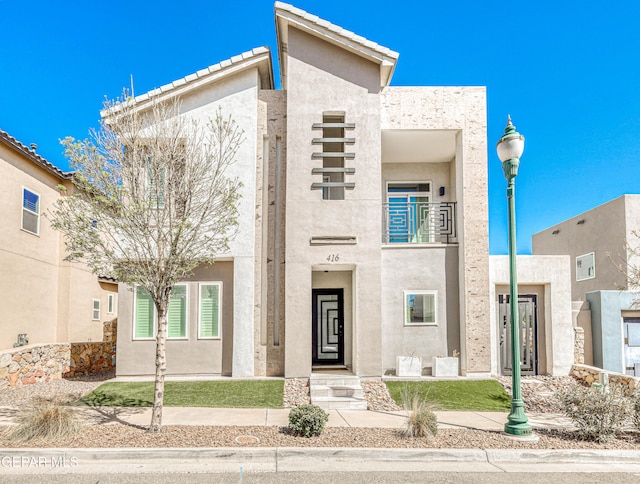 view of front of house featuring stucco siding