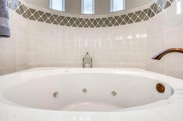 bathroom view of a tub with jets