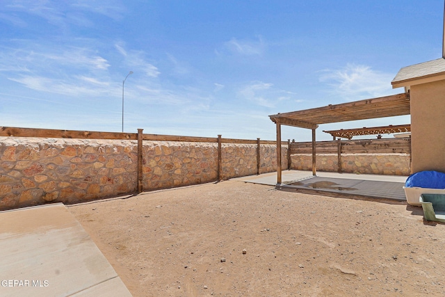 view of yard with a patio area, a pergola, and a fenced backyard