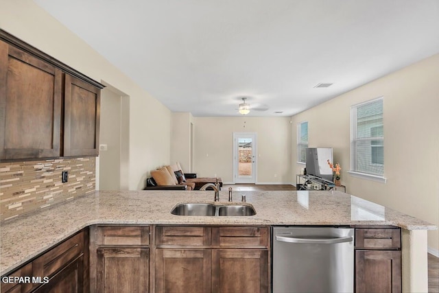 14920 Tierra Fortaleza Ave, El Paso, TX 79938 - kitchen with a peninsula, a sink, open floor plan, dishwasher, and tasteful backsplash