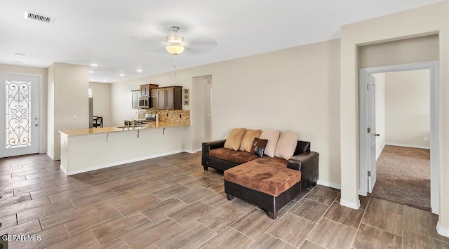 14920 Tierra Fortaleza Ave, El Paso, TX 79938 - living area featuring wood finish floors, visible vents, recessed lighting, ceiling fan, and baseboards
