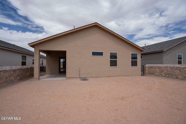 14920 Tierra Fortaleza Ave, El Paso, TX 79938 - rear view of house featuring a patio area, stucco siding, and fence