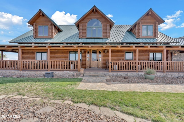 2 Scenic Ridge Rd N, Alpine, TX 99999 - log-style house with metal roof, a front yard, and a porch