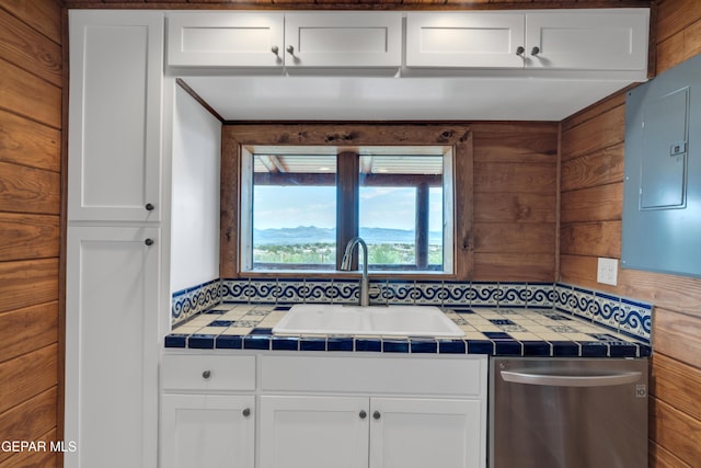2 Scenic Ridge Rd N, Alpine, TX 99999 - kitchen featuring stainless steel dishwasher, tile counters, a sink, and electric panel
