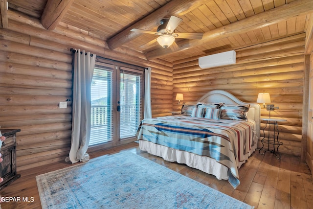 2 Scenic Ridge Rd N, Alpine, TX 99999 - bedroom featuring a wall mounted air conditioner, access to exterior, wood ceiling, log walls, and hardwood / wood-style floors
