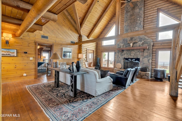 2 Scenic Ridge Rd N, Alpine, TX 99999 - living room with high vaulted ceiling, wooden ceiling, hardwood / wood-style floors, beamed ceiling, and a fireplace