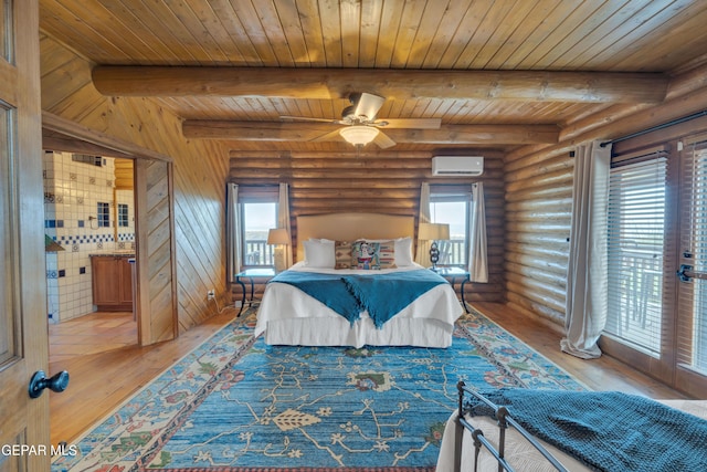 2 Scenic Ridge Rd N, Alpine, TX 99999 - bedroom featuring a wall unit AC, log walls, wooden ceiling, light wood-style flooring, and beamed ceiling