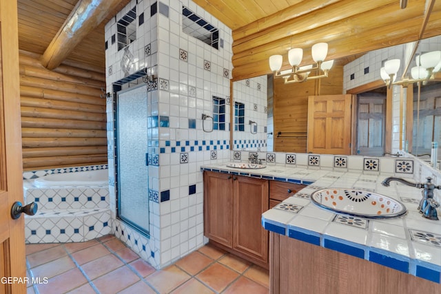 2 Scenic Ridge Rd N, Alpine, TX 99999 - bathroom featuring rustic walls, wood ceiling, a chandelier, tile patterned flooring, and beamed ceiling