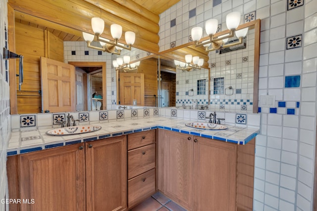 2 Scenic Ridge Rd N, Alpine, TX 99999 - bathroom featuring a chandelier, tasteful backsplash, double vanity, and tile patterned flooring