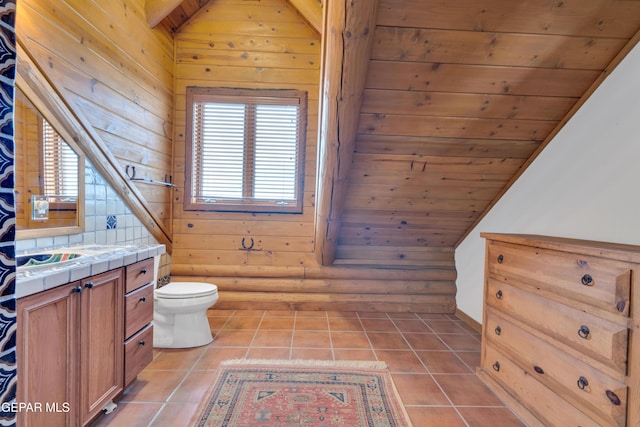 2 Scenic Ridge Rd N, Alpine, TX 99999 - bathroom featuring tile patterned floors, toilet, vanity, wooden ceiling, and vaulted ceiling
