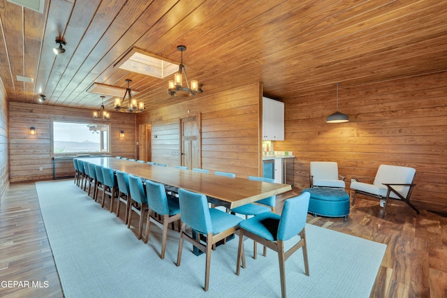 2 Scenic Ridge Rd N, Alpine, TX 99999 - dining room featuring a chandelier, wooden walls, wooden ceiling, and light wood-style flooring