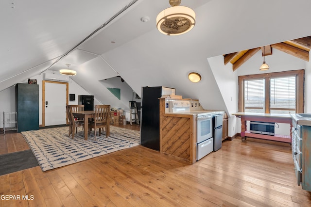 2 Scenic Ridge Rd N, Alpine, TX 99999 - kitchen with electric range, stainless steel microwave, light wood finished floors, and light countertops