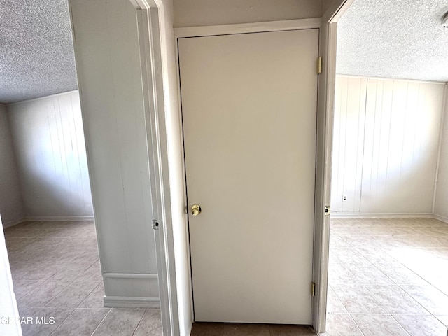45 S Boone St, El Paso, TX 79905 - interior space with a textured ceiling, baseboards, and light tile patterned floors