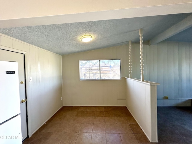 45 S Boone St, El Paso, TX 79905 - unfurnished room featuring vaulted ceiling, tile patterned flooring, and baseboards