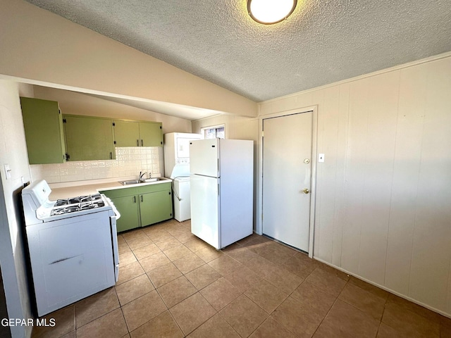 45 S Boone St, El Paso, TX 79905 - kitchen featuring a textured ceiling, green cabinets, white appliances, light tile patterned flooring, and light countertops
