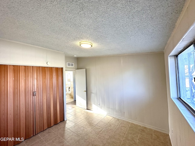 45 S Boone St, El Paso, TX 79905 - unfurnished bedroom featuring baseboards, tile patterned floors, and visible vents