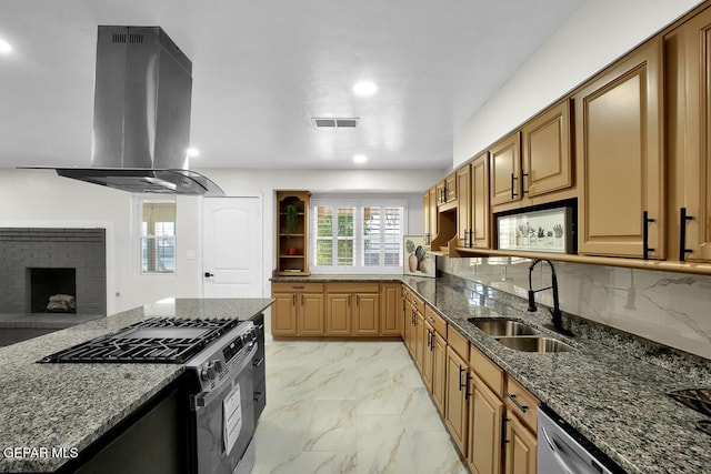 2801 Brady Pl, El Paso, TX 79935 - kitchen featuring marble finish floor, a sink, island range hood, stainless steel appliances, and dark stone counters