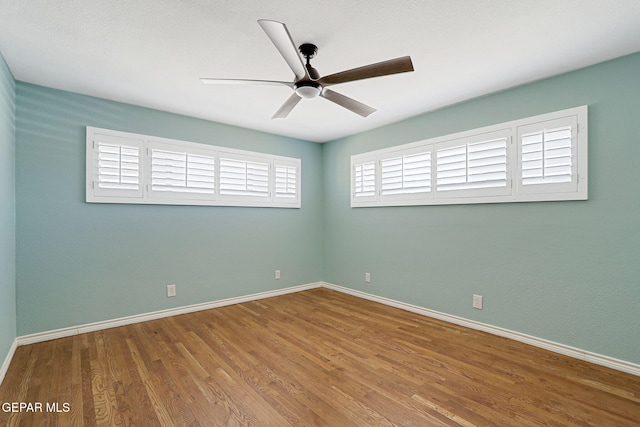 4731 Leeds Ave, El Paso, TX 79903 - unfurnished room featuring wood finished floors, baseboards, and a ceiling fan