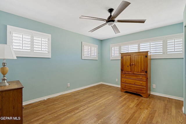 4731 Leeds Ave, El Paso, TX 79903 - unfurnished bedroom featuring baseboards, a ceiling fan, and wood finished floors